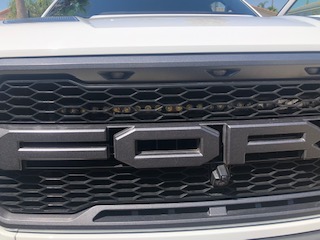 Raptor front light bar behind grill.jpeg