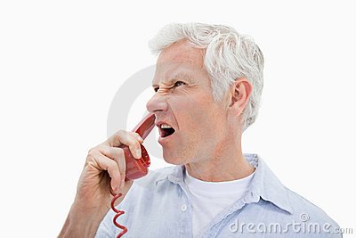 angry-man-making-phone-call-22663468.jpg